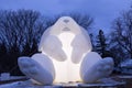 Blue hour low angle view of glowing giant inflatable rabbit