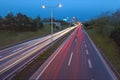 Blue hour photo on city highway with light trails Royalty Free Stock Photo