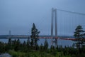 Blue hour picture of illuminated High Coast Bridge.