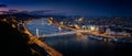 Blue hour shot. Panoramic look down from Gellert hill to castle hill, Danube river with parliament building, Elisabeth Bridge and Royalty Free Stock Photo