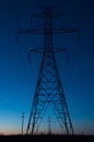 Blue hour silhouette of a power line tower