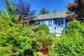 Blue house back yard with garden Royalty Free Stock Photo