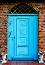 Blue house door from old brick house Royalty Free Stock Photo