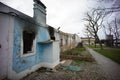 blue house in ruins destroyed by fire