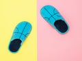 Blue house Slippers on pink and yellow background. The view from the top. Flat lay. Royalty Free Stock Photo