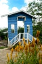 a blue house with a white fence with a blue sky a beautiful place in the banyuasin jokis park in Palembang, Indonesia Royalty Free Stock Photo