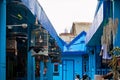 Blue houses with songbirds cages in village Kampung Biru Arema