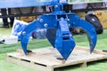 The blue hydraulic manipulator for loading steel scrap metal