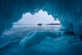 Blue ice cave in Baikal frozen lake in winter season, Siberia, Russia Royalty Free Stock Photo