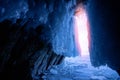 Blue ice cave grotto lake Baikal Olkhon island, Russia. Frozen clear icicles, beautiful winter landscape Royalty Free Stock Photo