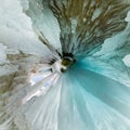 Blue Ice cave grotto on Olkhon Island, Lake Baikal, covered with icicles. Tiny little planet 360 Royalty Free Stock Photo
