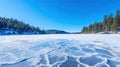 Blue ice and cracks on the surface of the ice. Frozen lake under a blue sky in the winter Royalty Free Stock Photo