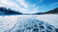 Blue ice and cracks on the surface of the ice. Frozen lake under a blue sky in the winter. Royalty Free Stock Photo