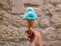 Blue ice-cream against stone wall Royalty Free Stock Photo