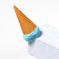 Blue Ice Cream in Wafer Cone Fell Down On Concrete Pedestal On White Background. 3d rendering. Royalty Free Stock Photo