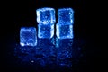 Blue ice cubes reflection on black table background Royalty Free Stock Photo