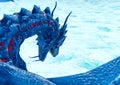 Blue ice dragon floating on frozen land rear view