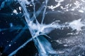 Blue ice of Lake Baikal. Ice texture with abstract cracks.