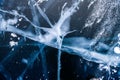 Blue ice of Lake Baikal. Ice texture with abstract cracks.