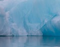 Blue ice and water. Detail of an iceberg in the Arctic Ocean at Svalbard, Norway. August 2017 Royalty Free Stock Photo