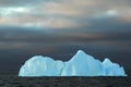 Blue iceberg with dark sky