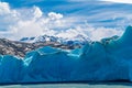 Blue Iceberg of Grey Glacier on Grey Lake and snowy mountain at Torres del Paine National Park in Southern Chilean Patagonia Royalty Free Stock Photo