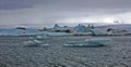 Blue Icebergs of Jokulsarlon with Snaefell Mountain, Iceland