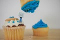 Blue iced cup cakes with note for Nos 1 dad