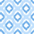Blue ikat seamless vector pattern. Textile fabric