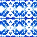 Blue ikat on a white background. Traditional Abstract art seamless pattern on the fabric