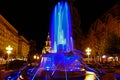 Blue illuminated fountain on the Plaza Opera in Timisoara Royalty Free Stock Photo