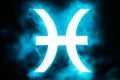 Blue illuminated Pisces zodiac sign with smoke Royalty Free Stock Photo