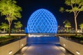 Blue illuminated sphere dome located next to Sheikh Zayed Grand Mosque in Abu Dhabi UAE, shot at night. Royalty Free Stock Photo