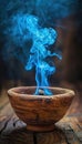 Blue incense smoke rising from a bowl on dark background with mystical vibes Royalty Free Stock Photo