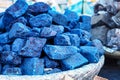 Blue indigo color stones displayed at traditional souk - street market in Marrakech, Morocco, closeup detail Royalty Free Stock Photo