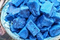 Blue indigo color stones displayed at traditional souk - street market in Marrakech, Morocco, closeup detail Royalty Free Stock Photo