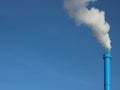 Blue Industrial Chimney on Sky Background with White Steam