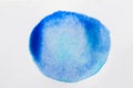 Blue ink blot on white canvas Royalty Free Stock Photo