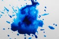 Blue ink blots on white canvas, top view Royalty Free Stock Photo