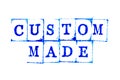 Blue ink of rubber stamp in word custom made on white paper background