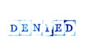 Blue ink of rubber stamp in word denied on white paper background