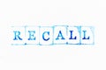 Blue ink rubber stamp in word recall on white paper background