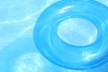 Blue inner tube on blue water Royalty Free Stock Photo