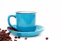 Blue instant coffee Cup on saucer and beans on white background close-up, copy space, flat lay Royalty Free Stock Photo