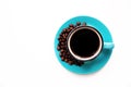 Blue instant coffee Cup on saucer and beans on white background close-up, copy space top view flat lay Royalty Free Stock Photo