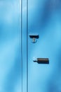 Blue iron garage door with lock. Close-up. Vertical. Front view. Space for text. Background Royalty Free Stock Photo