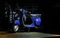 blue italian scooter outside italian restaurant