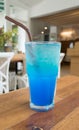 Blue italian soda on wood table Royalty Free Stock Photo