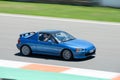 Blue Japanese Honda CR-X Del Sol racing around on a competition track