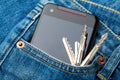 Blue jean pocket with mobile and key Royalty Free Stock Photo